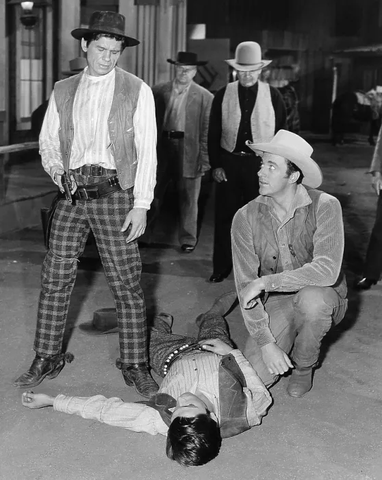 Framed Print : GUNSMOKE, from left: Charles Bronson, James Arness (kneeling), The Killer, (Season 1 | Episode 28, aired 26 May 1956), 1955-1975