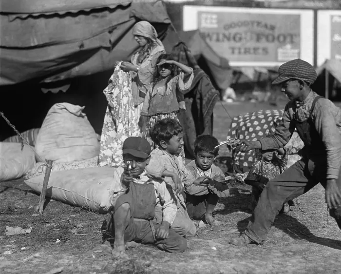 Framed Print : Gypsies children at play in an encampment, possibly a circus, in the Washington, D.C. Vicinity, 1923. Nearby a woman holds a garment among several stuffed bags in a tent Framed Print : Gypsies children at play in an encampment, possibly a circus, in the Washington, D.C. Vicinity, 1923. Nearby a woman holds a garment among several stuffed bags in a tent