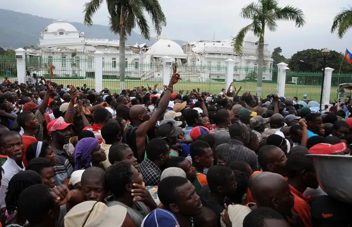 Framed Print : Haitians gathers for food distribution in front of the destroyed Presidential Palace in Port au Prince Haiti on Jan. 25 2010. A 7.0-magnitude earthquake on January 12 2010