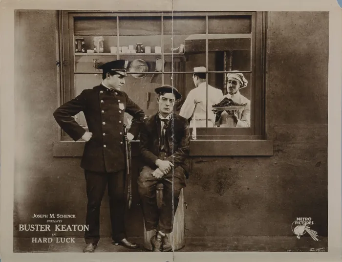 Framed Print : HARD LUCK, lobbycard, Buster Keaton (sitting), 1921