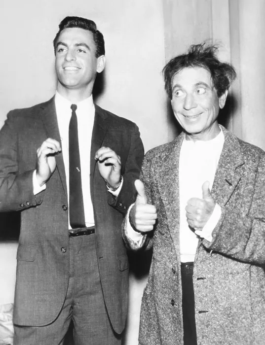 Framed Print : Harpo Marx gives a double thumbs up for his son, Bill. Jan 1961. Harpo and his wife actress Susan Fleming adopted four children: Bill, Alex, Jimmy, and Minnie