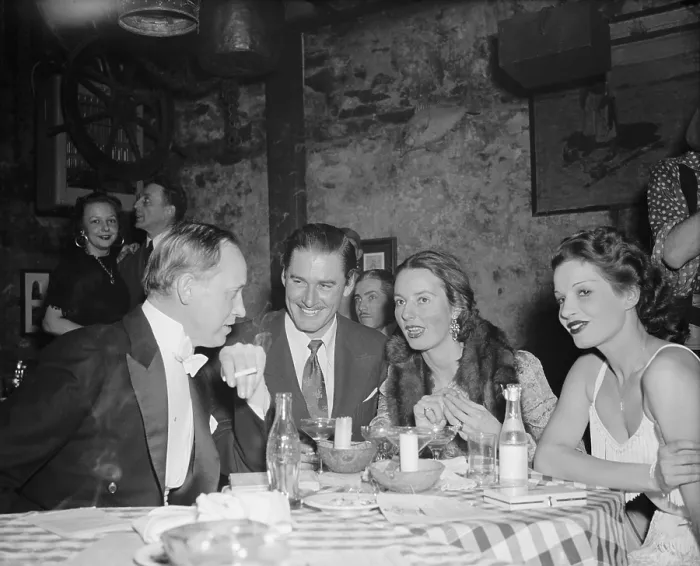 Framed Print : Harry Hopkins, Commerce Sec. out on the town with famous friends. Feb. 8, 1939. At a Washington supper club, L-R: Hopkins; actor Errol Flynn, and Mrs