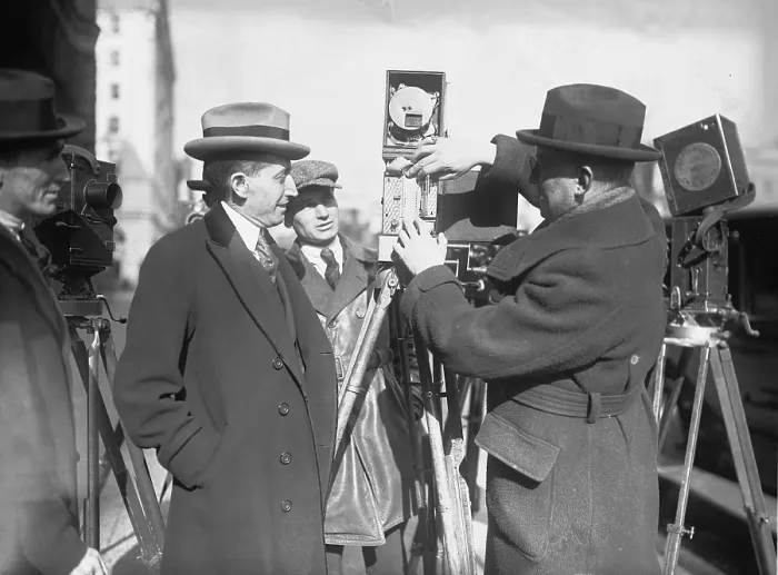 Framed Print : Will Hays (1879-1954), as Postmaster General, examines a newsman's movie camera. Jan. 14, 1922 Framed Print : Will Hays (1879-1954), as Postmaster General, examines a newsman's movie camera. Jan. 14, 1922