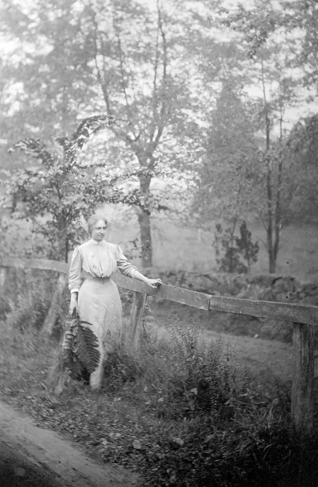 Framed Print : Helen Keller (1880-1968), blind and deaf since age 2, walking by fence, holding fern leaves, in 1907. g by fence, holding fern leaves, in 1907
