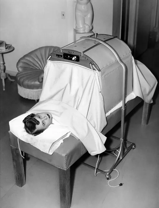 Framed Print : Helena Rubenstein Fifth Avenue Salon. Hair treatment is followed by massage. First, the baking machine where electrically heated blankets augment the infrared heat massage