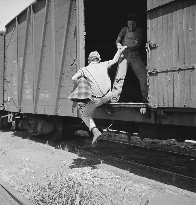 Framed Print : Helping a man hop a freight at Bakersfield, California, 1930s. (BSLOC_2013_8_196) Framed Print : Helping a man hop a freight at Bakersfield, California, 1930s. (BSLOC_2013_8_196)