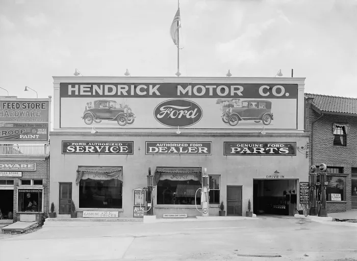 Framed Print : Hendrick Motor Co. in Washington, D.C. in the 1920s. They advertise as an authorized Ford dealer, that provides authorized Ford service, and genuine Ford parts (BSLOC_2016_10_114)