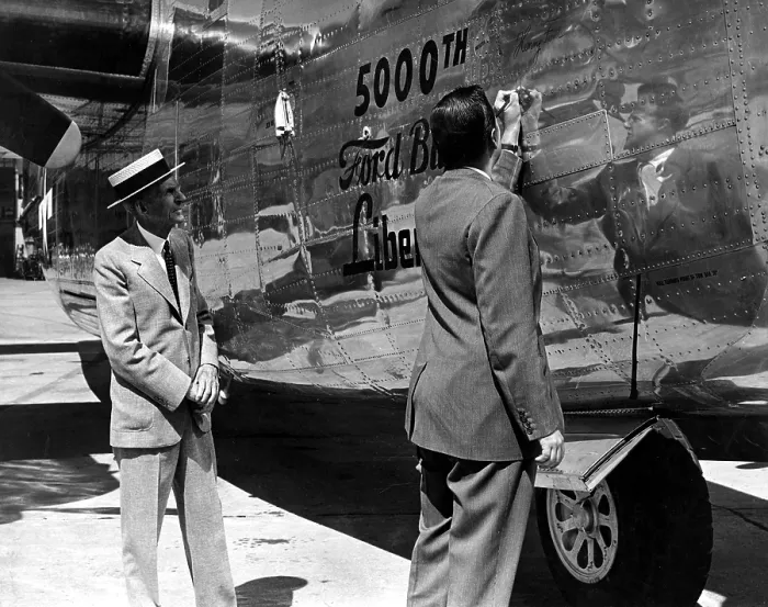 Framed Print : Henry Ford & grandson Henry Ford II, sign 5, 000th Liberator bomber built, 9 / 9 / 44. Courtesy: CSU Archives  /  Everett Collection