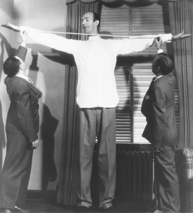 Framed Print : Henry Hite, the Chicago giant, is measured for his shirts. July 31, 1946
