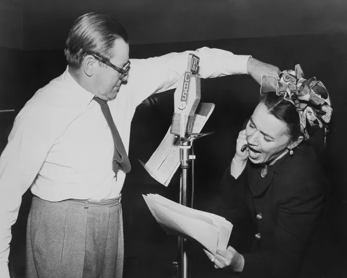 Framed Print : Herbert Marshall striking a blow, murdering his wife, in a radio play, Back for the Holidays