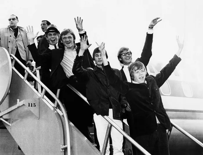 Framed Print : Herman's Hermits arrive in New York from a tour of Japan, Feb. 1966. At the time, the group out-ranked the Beatles in worldwide popularity polls. They were in the U.S