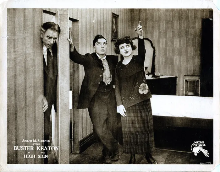 Framed Print : THE HIGH SIGN, lobbycard, Buster Keaton (center), Bartine Burkett (right), 1921
