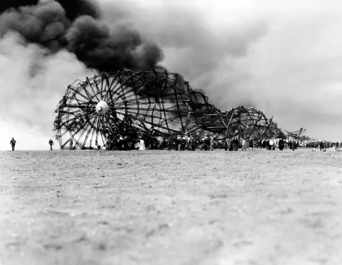 Framed Print : Hindenburg crash at Lake Hurst, New Jersey. The skeleton of the still burning Zeppelin on the ground after bursting in flames while landing. May 6, 1937