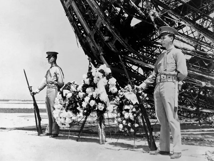 Framed Print : Hindenburg dead are honored on Memorial Day. Two U.S. Marines stand guard at the wreath place at the prow of the ill-fated dirigible