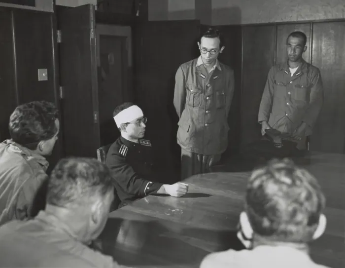 Framed Print : Hirokuni Dazai, bandaged leader of Hiroshima local police, tells American military of the atomic bombing