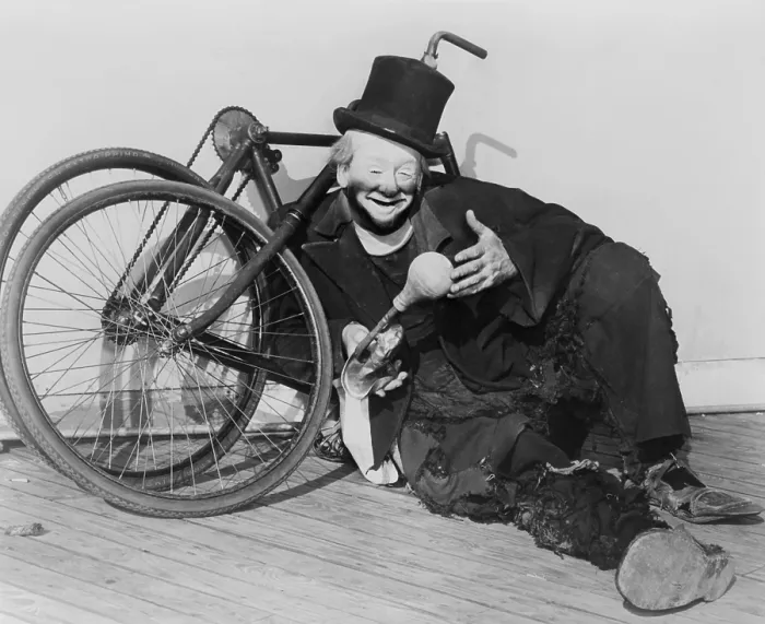 Framed Print : Hobo clown Joe Jackson reclining against a disassembled bicycle at the New York World's Fair in 1940