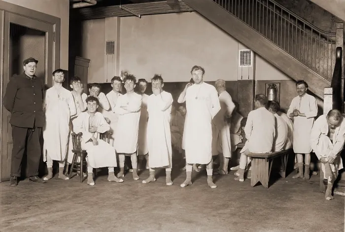 Framed Print : Homeless men in New York City's Municipal Lodging House dressed for bed. To prevent pest infestations they were required to wear nightshirts provided to them by the shelter
