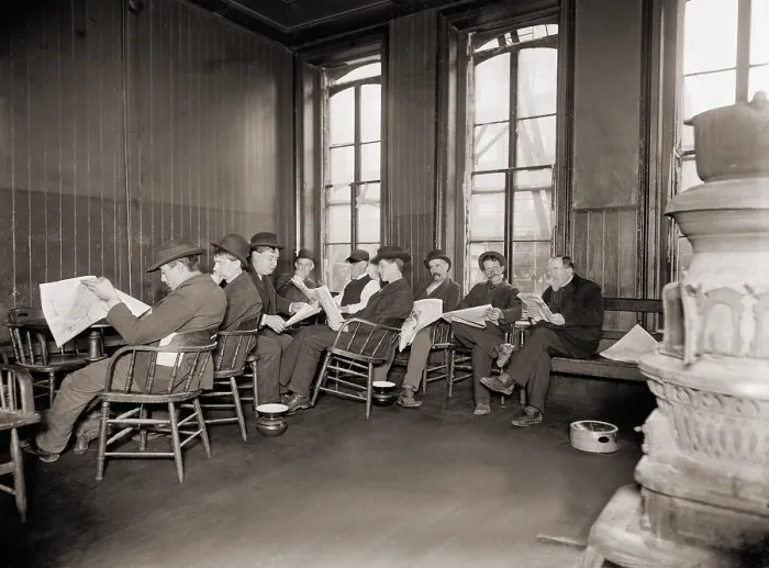 Framed Print : Homeless men in the reading room of a dime a night Bowery lodging house in 1910
