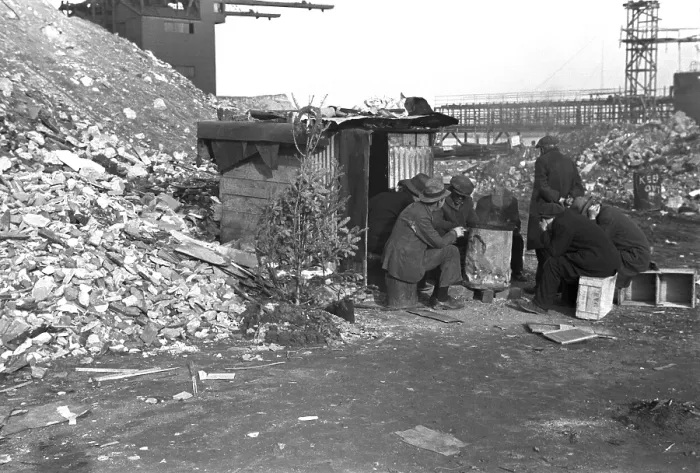 Framed Print : Hooverville at East 12th Street, New York City. Unemployed workers sit on crates by a shack with Christmas tree. January 1938 photo by Russell Lee