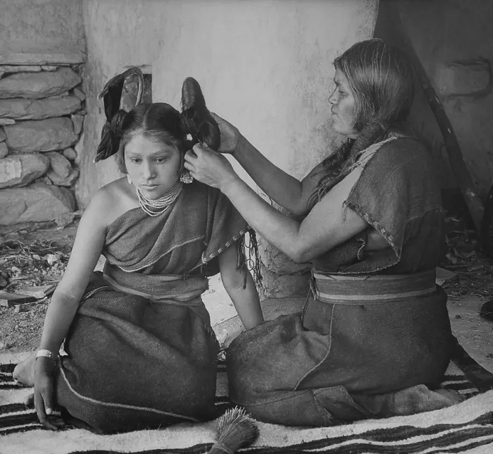 Framed Print : A Hopi woman dresses the hair of young unmarried women, ca. 1900, by Henry Peabody