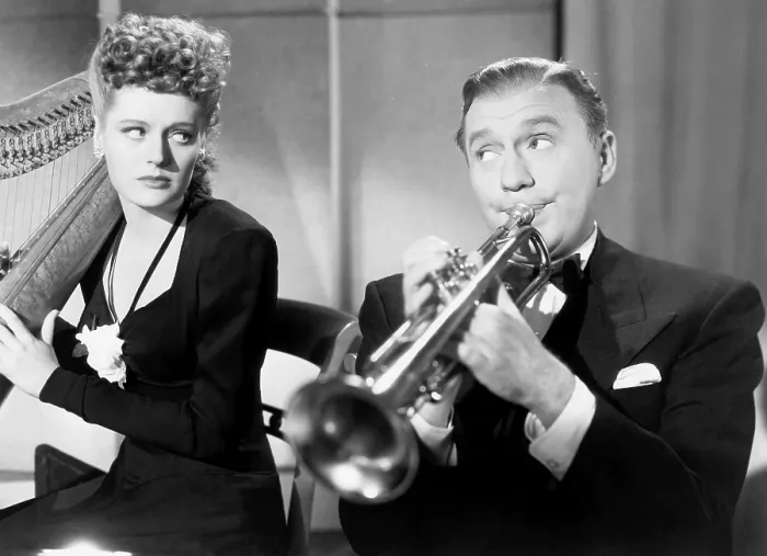 Framed Print : THE HORN BLOWS AT MIDNIGHT, from left, Alexis Smith, Jack Benny, 1945