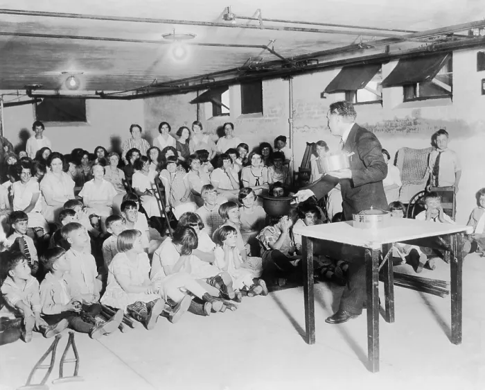 Framed Print : Houdini performs for an audience of hospitalized children. Ca. 1925