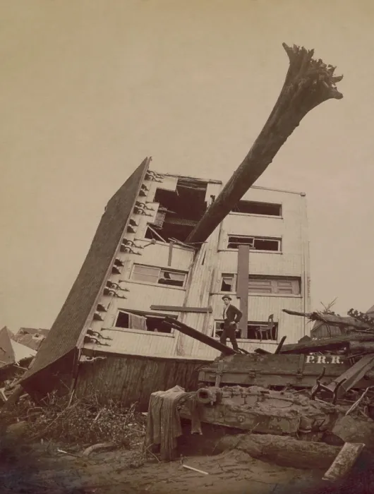 Framed Print : A house wrecked in the Johnstown Flood of May 31, 1889. The building lies on its side in a pile of rubble with a tree trunk extending through a window Framed Print : A house wrecked in the Johnstown Flood of May 31, 1889. The building lies on its side in a pile of rubble with a tree trunk extending through a window