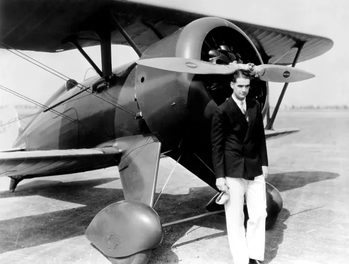 Framed Print : Howard Hughes, with Boeing Pursuit Plane, (no date) Framed Print : Howard Hughes, with Boeing Pursuit Plane, (no date)