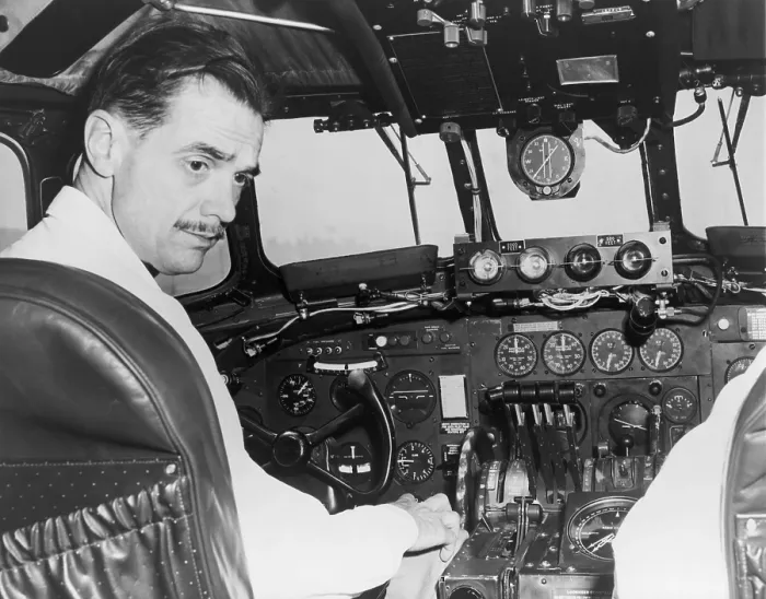 Framed Print : Howard Hughes seated in the cockpit TWA Constellation to demonstrate a new radar terrain clearance warning system that sounds a horn when the plane comes within 2000 feet of any Framed Print : Howard Hughes seated in the cockpit TWA Constellation to demonstrate a new radar terrain clearance warning system that sounds a horn when the plane comes within 2000 feet of any
