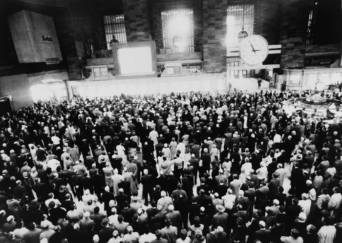 Framed Print : Hundreds of people gathered before a large screen television in New York's Grand Central Station to watch coverage of President Kennedy's funeral on November 25, 1963