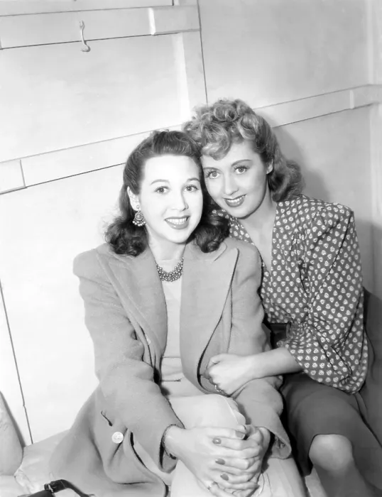 Framed Print : I WANT A DIVORCE, from left: Gloria Blondell visiting her sister Joan Blondell on set, 1940