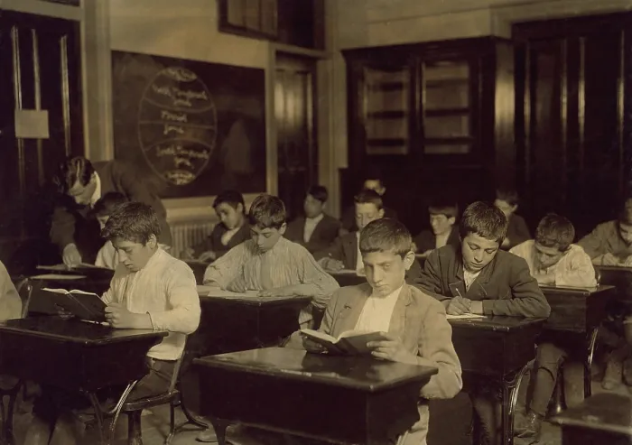 Framed Print : Immigrant boys in night school in Boston Massachusetts, many of whom were unable to attend day classes because they worked during the day. Photograph by Lewis Hine, October 1909