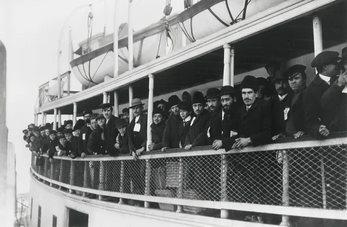 Framed Print : Immigrant men on an Ellis Island Ferry, c. 1905