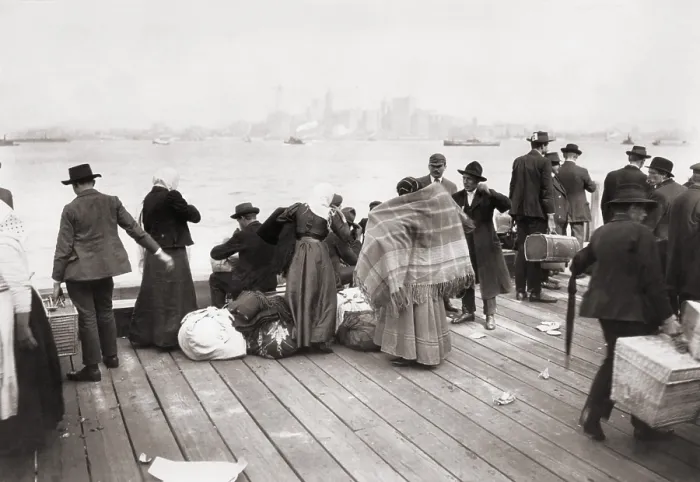 Framed Print : Immigrants waiting to be transferred by ferry from Ellis Island, on October 30, 1912. In the distance is their first destination, New York City Framed Print : Immigrants waiting to be transferred by ferry from Ellis Island, on October 30, 1912. In the distance is their first destination, New York City