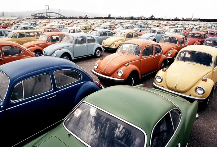 Framed Print : Imported Volkswagen Beetles on an American pier. These German cars Japanese cars were among the millions imported to compete with the large gas guzzling American cars. Ca.1973-75