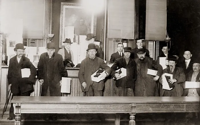 Framed Print : Impoverished Bowery men, pose for a group photo to document the generosity of local politician Tim Sullivan (1862 -1913), who gave them a gift of new shoes and socks. 1910