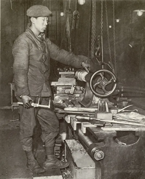 Framed Print : Indo-Chinese workman at ammunition factory lathe in France during WW1. 1916-17. The French colonies of Tonquin, Cochin, and Saigon offered a recruiting field for war workers