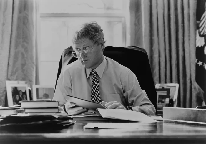 Framed Print : Informal portrait of President Bill Clinton at his desk in the Oval Office. 1993. (BSLOC_2015_2_187) Framed Print : Informal portrait of President Bill Clinton at his desk in the Oval Office. 1993. (BSLOC_2015_2_187)