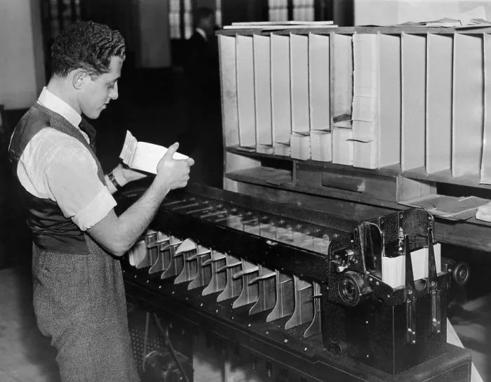 Framed Print : Information technology installed in the Social Security Department. A worker at of the automatic card sorters as it was being operated. Nov. 27, 1936