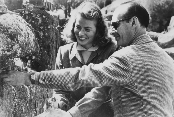 Framed Print : Ingrid Bergman and Roberto Rossellini became lovers during the filming of STROMBOLI, April 1949. Bergman is holding the flowers he collects, in the first months of their romance