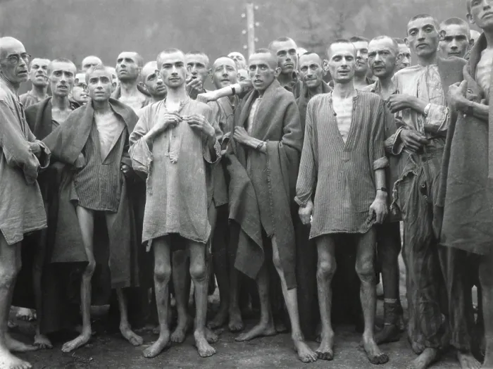 Framed Print : Inmates of Ebensee concentration camp after their liberation by American troops on May 6, 1945. Ebensee provided slave labor to build tunnels for armaments storage