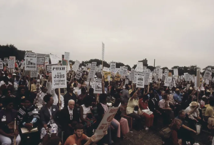 Framed Print : Integrated group of including senior citizens protesting against 1970s inflation unemployment and high taxes along Lakeshore Drive in Chicago