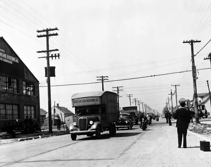 Framed Print : Integration. A convoy of African-American moving trucks protected by police cars. Whites had protested integration of the Sojourner Truth homes, a new U.S