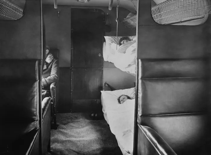 Framed Print : Interior of Junkers plane with passenger sitting in leather armchair seats. In the foreground are sleeping bunks (BSLOC_2016_10_166) Framed Print : Interior of Junkers plane with passenger sitting in leather armchair seats. In the foreground are sleeping bunks (BSLOC_2016_10_166)
