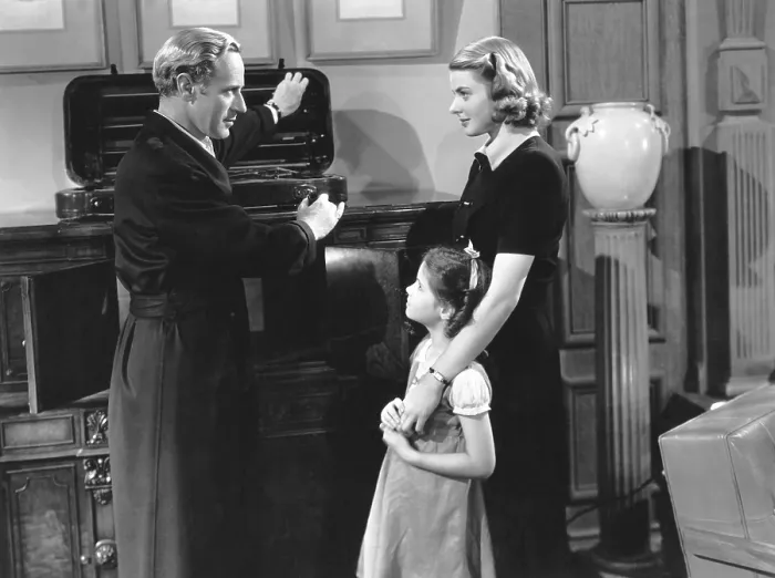 Framed Print : INTERMEZZO: A LOVE STORY, from left, Leslie Howard, Joan Carroll, Ingrid Bergman, 1939