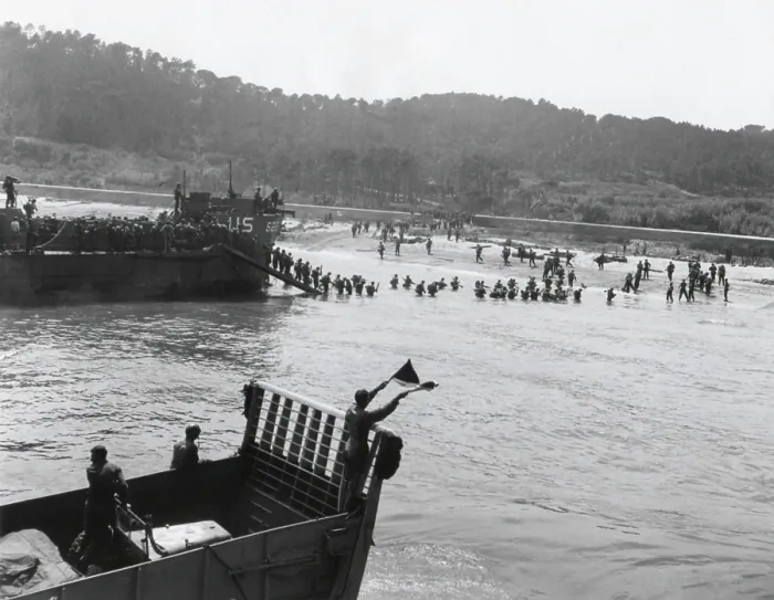 Framed Print : Invasion beach in southern France on D-Day, Aug. 15, 1944. Allied assault troops from landing craft advance through a breach in a defense wall blasted by assault engineers
