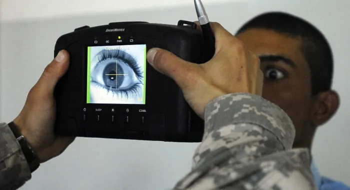 Framed Print : An Iraqi police recruit holds his eye open for a retinal scan administered by a US Soldier in Mahmudiyah Iraq May 30 2007. (BSLOC_2011_12_288) Framed Print : An Iraqi police recruit holds his eye open for a retinal scan administered by a US Soldier in Mahmudiyah Iraq May 30 2007. (BSLOC_2011_12_288)