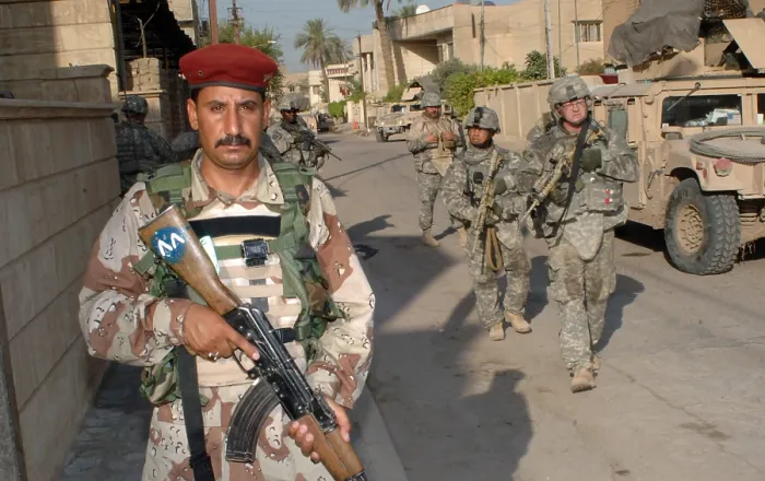 Framed Print : An Iraqi soldier leads the way during a search operation with US Army soldiers in the Rusafa area of Baghdad Iraq June 19 2007. (BSLOC_2011_12_156)
