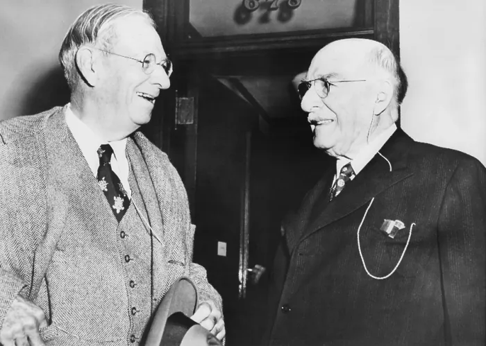 Framed Print : Irenee DuPont (left) discusses the day's court proceedings with his brother, Pierre