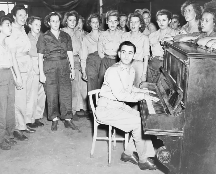 Framed Print : Irving Berlin (1888-1989), playing one of his songs as WACs sing, in Papua New Guinea during World War II Framed Print : Irving Berlin (1888-1989), playing one of his songs as WACs sing, in Papua New Guinea during World War II